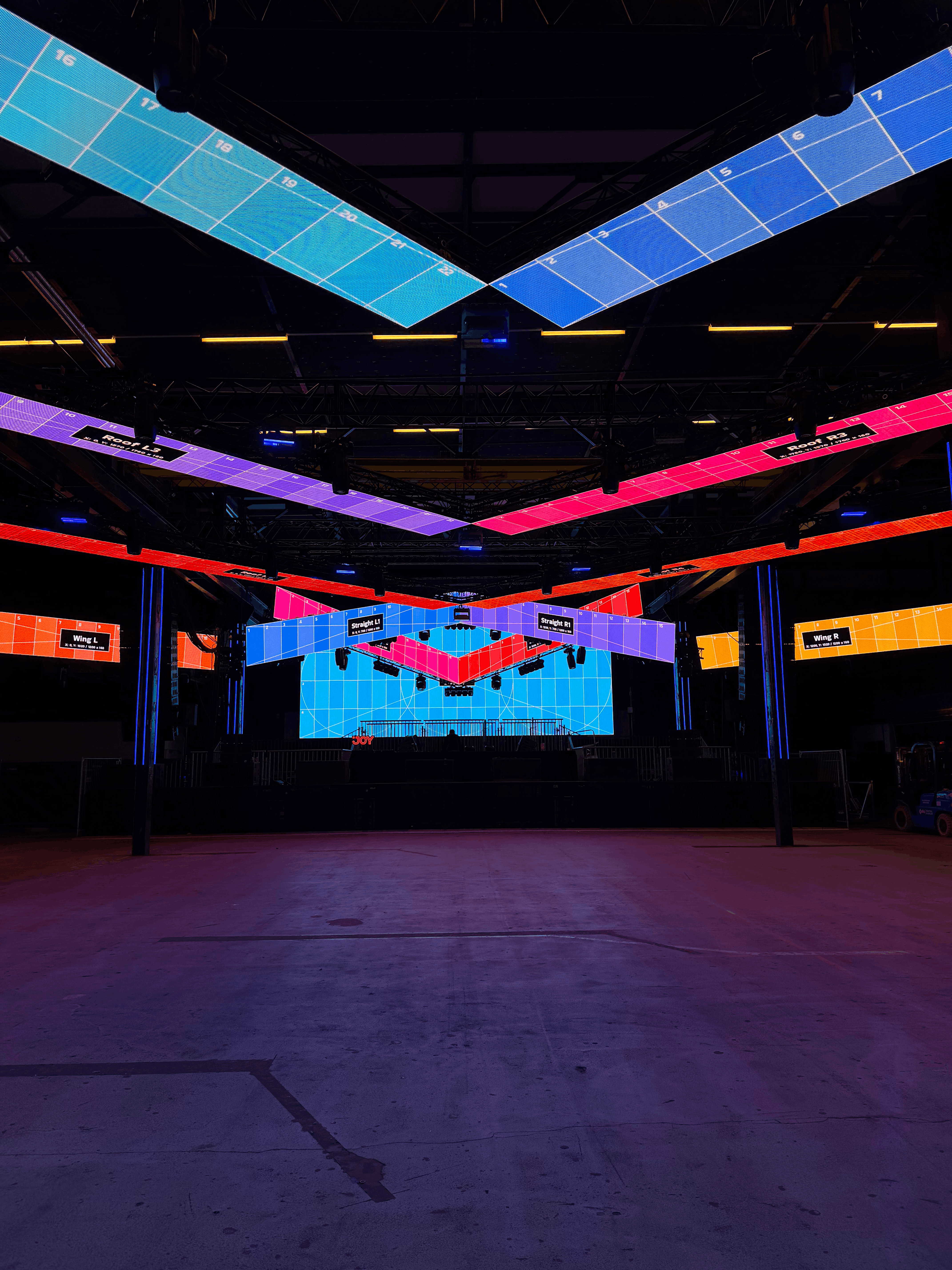 LED video wall stage setup with multiple panel configurations at a live event